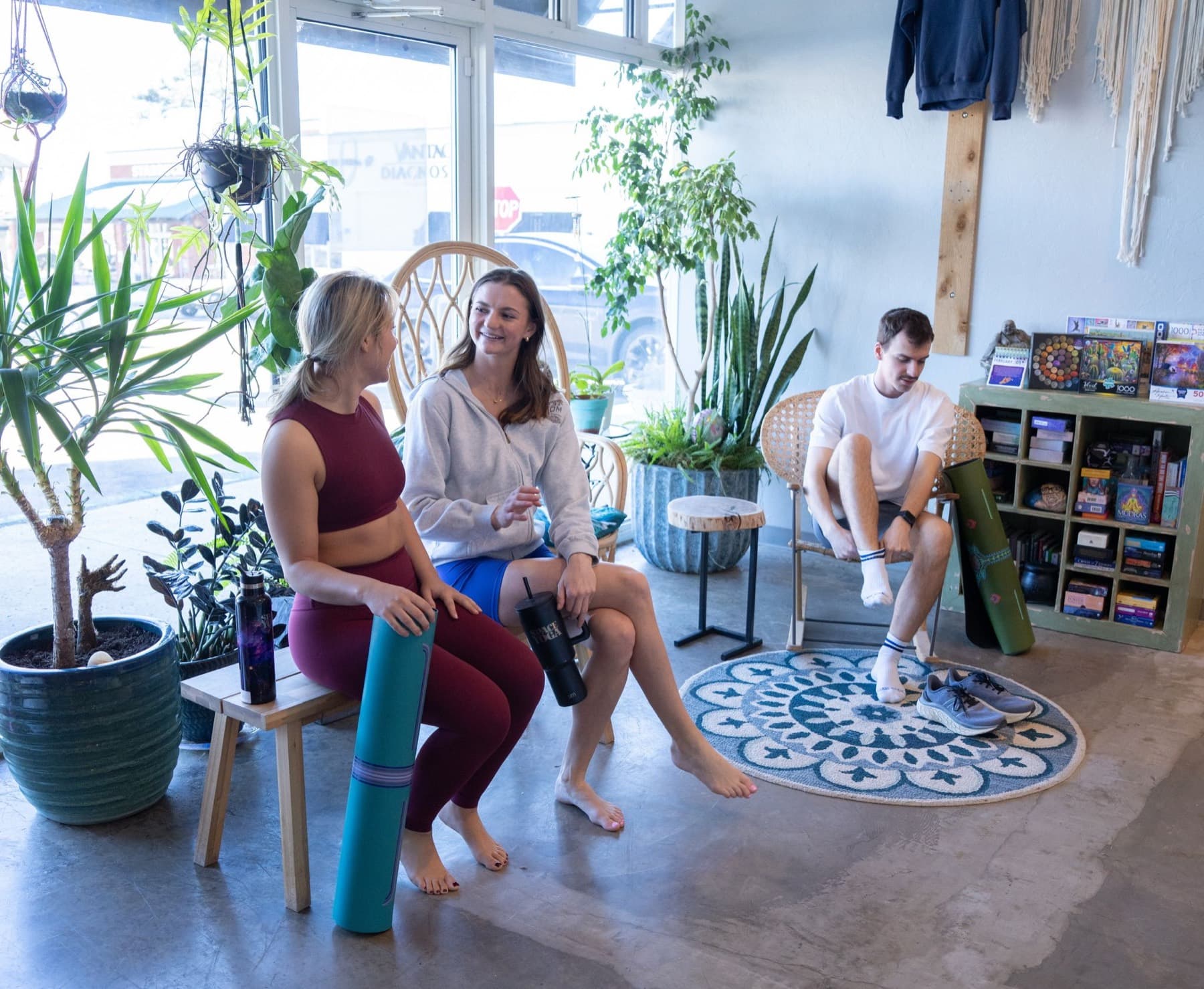 Students arriving with their yoga mats and getting settled at SPACE
