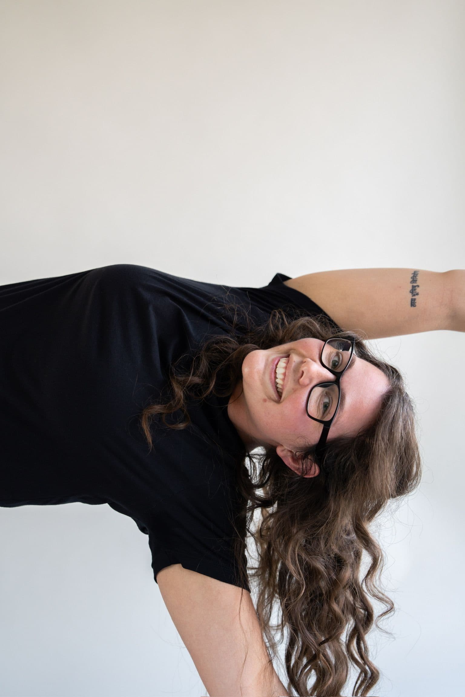 Yoga student in a joyful side stretch